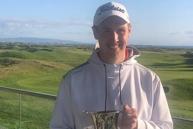 Kemnay's Fraser Laird shows off the trophy after winning the Stephen Gallacher Foundation Boys' Invitational at Dundonald Links. Picture: SGF