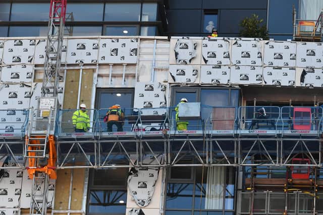 Work is carried out to remove dangerous cladding on a Glasgow high-rise building. Picture: John Devlin