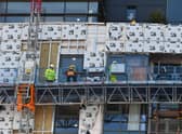 Work is carried out to remove dangerous cladding on a Glasgow high-rise building. Picture: John  Devlin