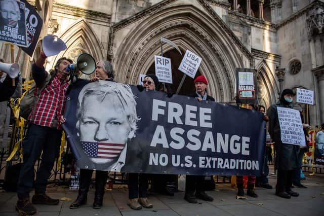 Supporters of Julian Assange protest outside the Royal Courts of Justice in December when the High Court ruled that he could be extradited to the United States (Picture: Chris J Ratcliffe/Getty Images)