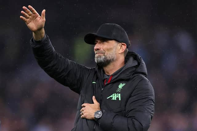 Jurgen Klopp waves to Liverpool fans following his penultimate match in charge - the 3-3 draw at Aston Villa on Monday. (Photo by Alex Pantling/Getty Images)