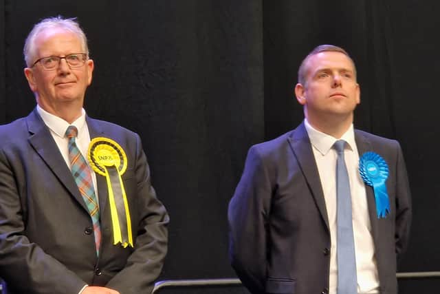 Douglas Ross, right, of the Scottish Conservatives, at the count in Aberdeen last week, where he lost the Aberdeenshire North and Moray East seat to the SNP's Seamus Logan, left