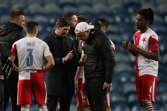 Steven Gerrard, manager of Rangers speaks with Jindrich Trpisovsky, Head Coach of Slavia Praha following the UEFA Europa League Round of 16 Second Leg match between Rangers and Slavia Praha at Ibrox Stadium on March 18, 2021 in Glasgow, Scotland. (Photo by Ian MacNicol/Getty Images)