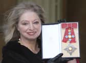 Dame Hilary Mantel holding her Dame Commander of the British Empire medal presented to her for services to literature at an Investiture ceremony at Buckingham Palace in central London. The Wolf Hall writer has died "suddenly yet peacefully" surrounded by close family and friends aged 70, HarperCollins has announced.
