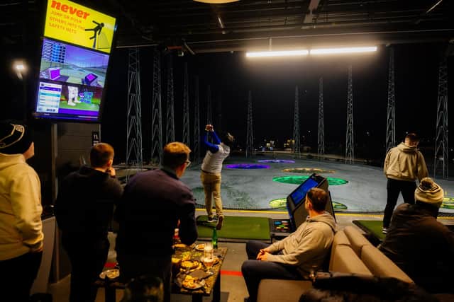 One of the big attractions about Topgolf facilities is that people can enjoy food and drink during a session. Picture: Topgolf