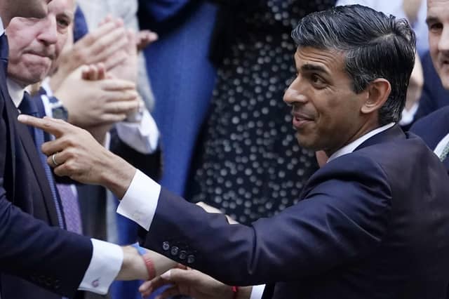 Rishi Sunak gestures as conservative MPs greet him after arriving at the Conservative Party leadership contest at the Conservative party Headquarters in London. Picture: AP Photo/Aberto Pezzali