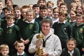 Bob MacIntyre proudly shows off the Ryder Cup to pupils of St Columba's Primary School in his hometown of Oban. Picture: Bounce Sport Management
