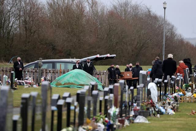The coffin of Nicole Anderson is carried to the graveside after it arrived at Riccarton Cemetery in Kilmarnock picture: Andrew Milligan/PA