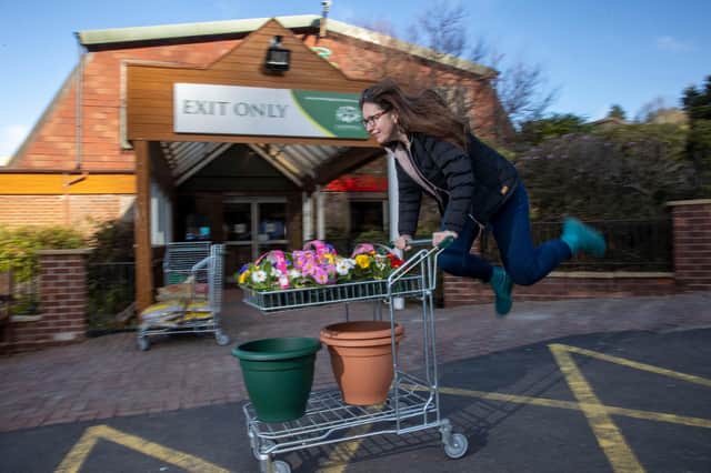 Louise Harris, 38,  jumping for joy after she had collected her plants (Photo: Jeff Holmes,  JSHPIX).