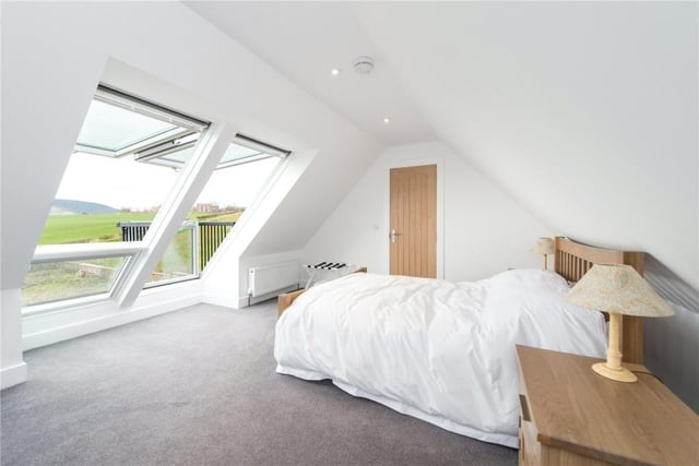 Bedroom 4 has built in storage and bi-fold Velux windows which open onto a balcony.