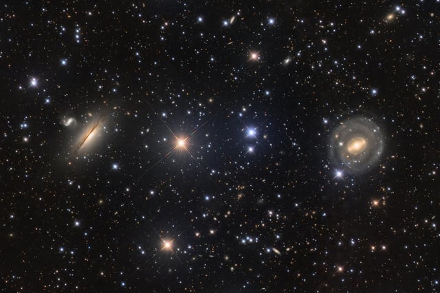 Highly Commended 
Neighbours © Paul Montague
A deep-space photograph showing galaxies NGC 5078 and IC879, to the left, and NGC 5101 on the right. The detailed image captures the hazy dust of the galaxies clearly.  
‘These neighbouring galaxies have been beautifully photographed co-existing against a background of stars and more distant galaxies. The minute details of both galaxies have been perfectly captured, while the surrounding objects that make up this stunning scene have been imaged so clearly. There is so much more to look at that you find yourself wanting to explore the picture in greater detail.’ - Melissa Brobby
Taken with a GSO Ritchey-Chretien 8" telescope, Chroma LRGB 31 mm filters, Astro-Physics Mach1 mount, ZWO ASI294MM Pro camera, 1,200 mm f/6, multiple 3-minute Luminance and 5-minute RGB exposures, approx. 17 hours total exposure

Location: Bendleby Ranges, South Australia, Australia