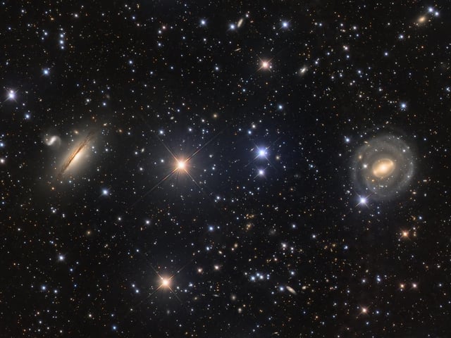 Highly Commended 
Neighbours © Paul Montague
A deep-space photograph showing galaxies NGC 5078 and IC879, to the left, and NGC 5101 on the right. The detailed image captures the hazy dust of the galaxies clearly.  
‘These neighbouring galaxies have been beautifully photographed co-existing against a background of stars and more distant galaxies. The minute details of both galaxies have been perfectly captured, while the surrounding objects that make up this stunning scene have been imaged so clearly. There is so much more to look at that you find yourself wanting to explore the picture in greater detail.’ - Melissa Brobby
Taken with a GSO Ritchey-Chretien 8" telescope, Chroma LRGB 31 mm filters, Astro-Physics Mach1 mount, ZWO ASI294MM Pro camera, 1,200 mm f/6, multiple 3-minute Luminance and 5-minute RGB exposures, approx. 17 hours total exposure

Location: Bendleby Ranges, South Australia, Australia