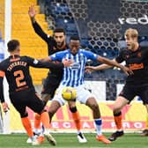 Kilmarnock's Nicke Kabamba (centre) holds off Connor Goldson during a Scottish Premeriship match between Kilmarnock and Rangers at Rugby Park, on November 01, 2020, in Kilmarnock, Scotland. (Photo by Rob Casey / SNS Group)