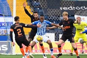 Kilmarnock's Nicke Kabamba (centre) holds off Connor Goldson during a Scottish Premeriship match between Kilmarnock and Rangers at Rugby Park, on November 01, 2020, in Kilmarnock, Scotland. (Photo by Rob Casey / SNS Group)