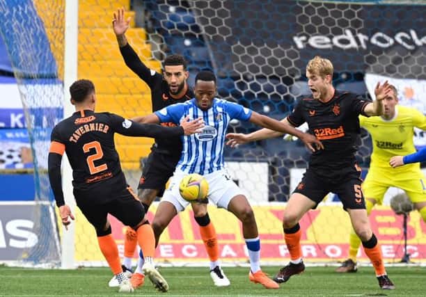 Kilmarnock's Nicke Kabamba (centre) holds off Connor Goldson during a Scottish Premeriship match between Kilmarnock and Rangers at Rugby Park, on November 01, 2020, in Kilmarnock, Scotland. (Photo by Rob Casey / SNS Group)