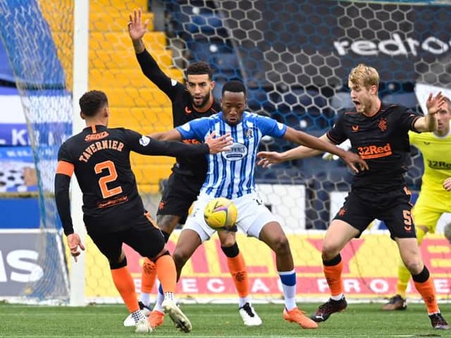Kilmarnock's Nicke Kabamba (centre) holds off Connor Goldson during a Scottish Premeriship match between Kilmarnock and Rangers at Rugby Park, on November 01, 2020, in Kilmarnock, Scotland. (Photo by Rob Casey / SNS Group)