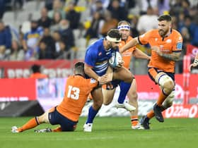 Edinburgh's Mark Bennett tackles JJ Kotze of the Stormers during the United Rugby Championship quarter-final in Cape Town. (Photo by Ashley Vlotman/Gallo Images/Getty Images)