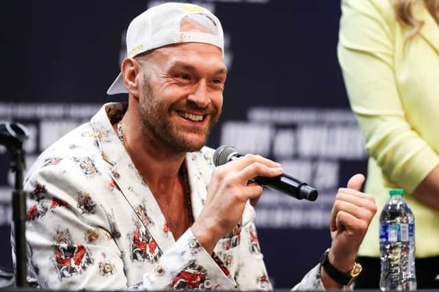 Tyson Fury speaks at the press conference with Deontay Wilder . (Photo by Meg Oliphant/Getty Images)