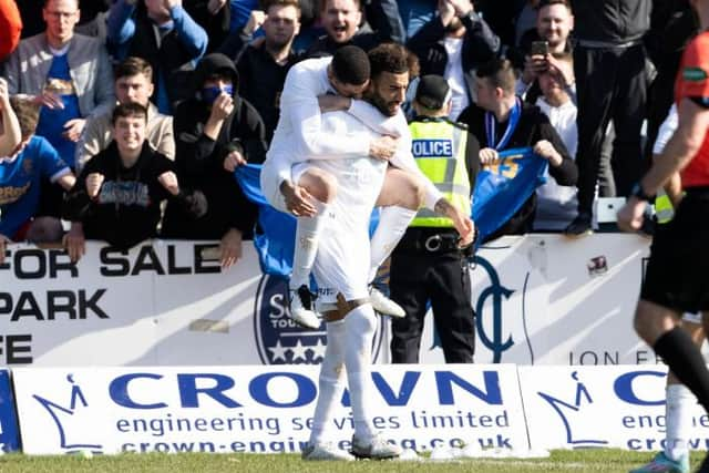 Connor Goldson, scorer of Rangers winning goal at Dens Park, celebrates with Leon Balogun at full-time. (Photo by Alan Harvey / SNS Group)