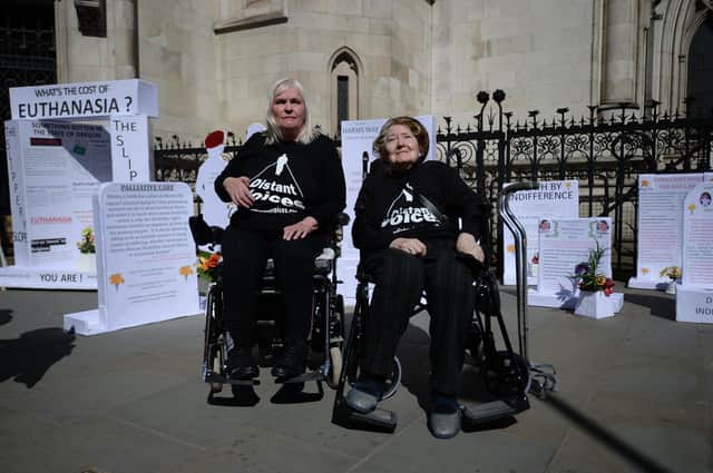 Nicki Kenward (left) and Elspeth Chowdharay, of campaign group Distant Voices, protest against assisted suicide outside the Royal Courts of Justice in London (Picture: Kirsty O'Connor/PA)