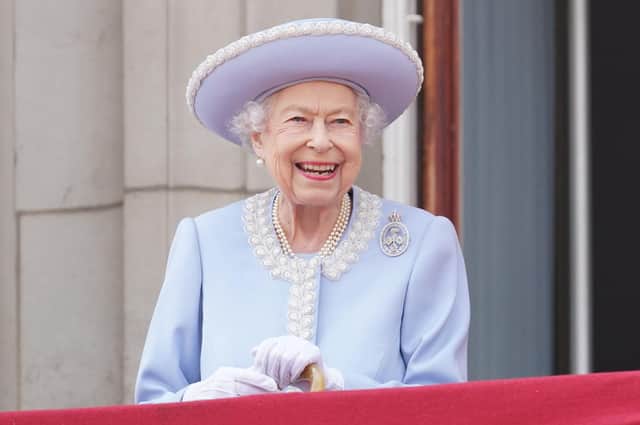 Queen Elizabeth II watches from the balcony during the Trooping the Colour ceremony.