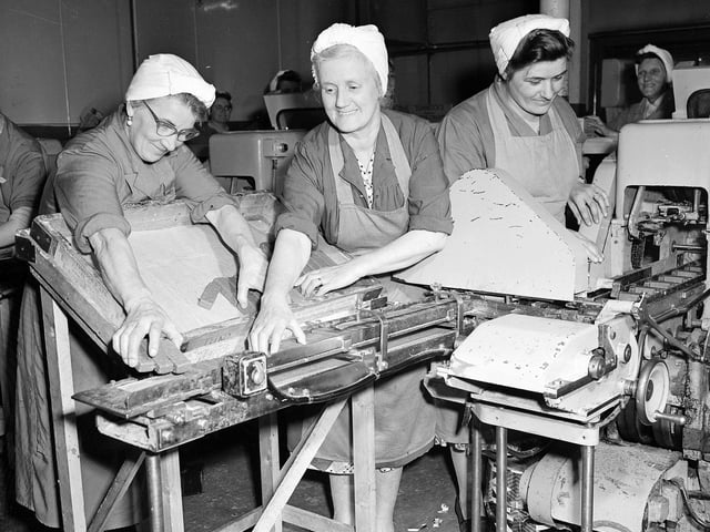 In the 1960s the Tunnock's factory grew to cope with demand for the newly developed biscuits. Here, workers are feeding chocolate wafers into the wrapping machine.