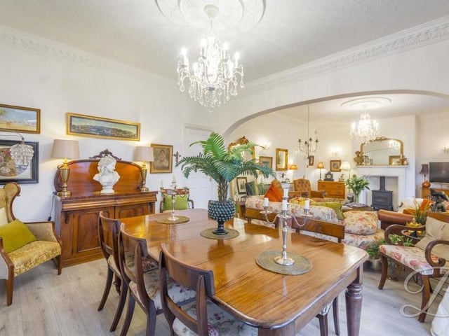 Next to the main living room, as part of an open-plan space, is this elegant dining room, which is perfect for sit-down meals or games with the family.