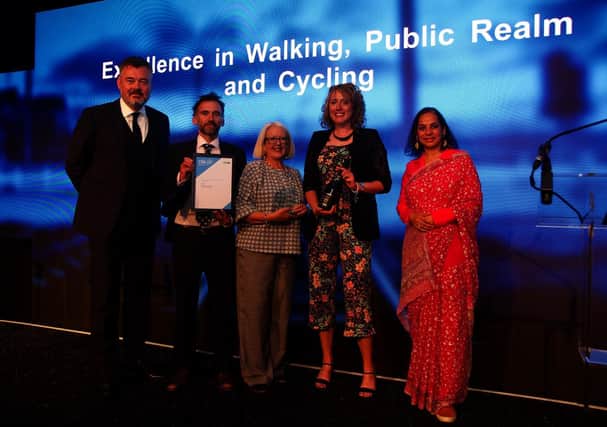Council strategy team leader Chris Menzies (second left) and ISC vice-chair Cllr Isobel Davidson (centre) collect the award for the Aberdeenshire Bothy project.