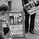 Detectives putting up Evening News posters in the High Street seeking information about the The World's End murders in Edinburgh in 1977