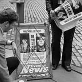 Detectives putting up Evening News posters in the High Street seeking information about the The World's End murders in Edinburgh in 1977