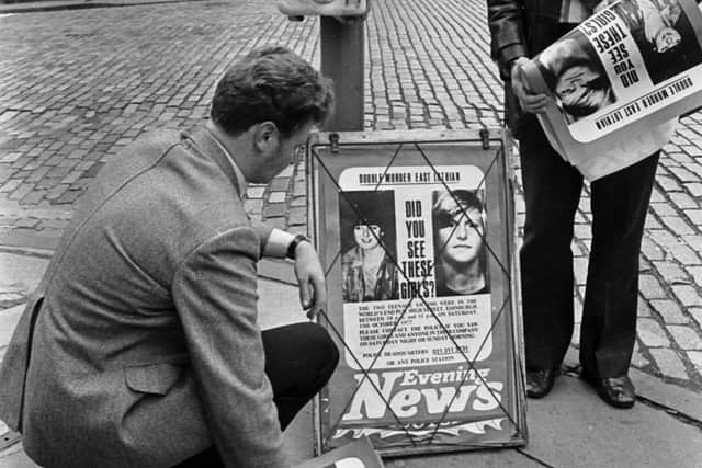 Detectives putting up Evening News posters in the High Street seeking information about the The World's End murders in Edinburgh in 1977