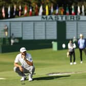Dustin Johnson lines up a putt on the ninth green during the third round of the Masters at Augusta National. Picture: Patrick Smith/Getty Images