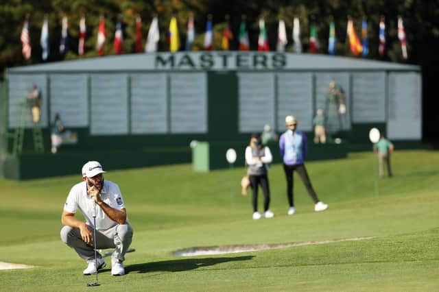 Dustin Johnson lines up a putt on the ninth green during the third round of the Masters at Augusta National. Picture: Patrick Smith/Getty Images