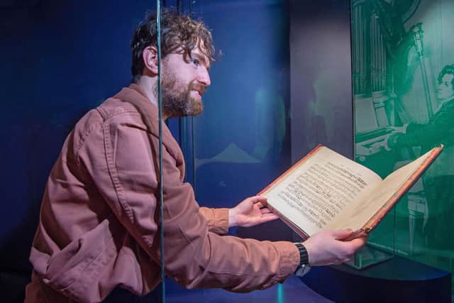 Conservation exhibitions specialist Ryan Gibson installing material related to Ludwig van Beethoven at the new Treasures gallery at the National Library of Scotland. Picture: Neil Hanna