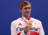 Stephen Clegg shows off his bronze medal.