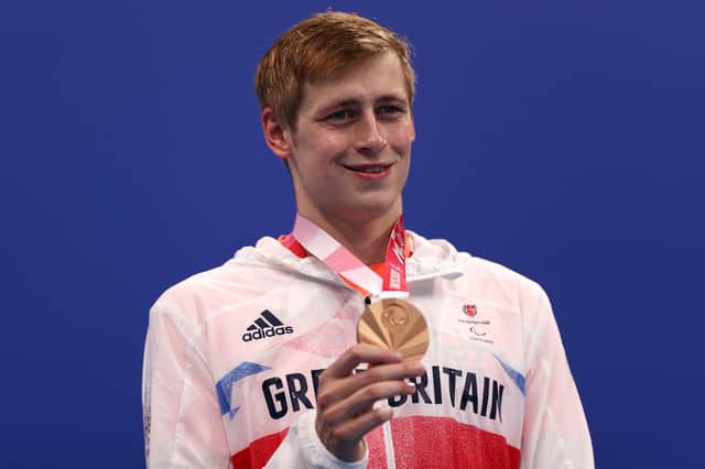Stephen Clegg shows off his bronze medal.