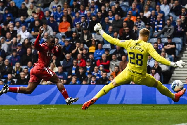 Robby McCrorie makes an excellent save on a rare Rangers start to deny Aberdeen forward Duk.