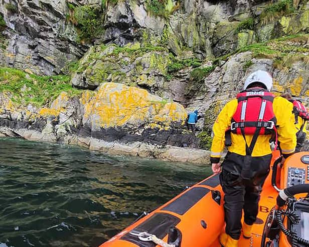 The experienced 72-year-old hillwalker being rescued by a lifeboat crew