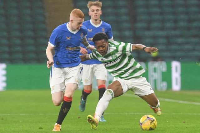 Rangers defender Adam Devine tussles with Celtic forward Karamoko Dembele during the Lowland League match at Celtic Park on April 12. (Photo by Craig Foy / SNS Group)