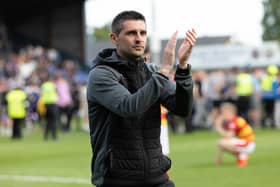 Kris Doolan applauds the Partick Thistle support after they lost the Premiership play-off on penalties. (Photo by Ross Parker / SNS Group)
