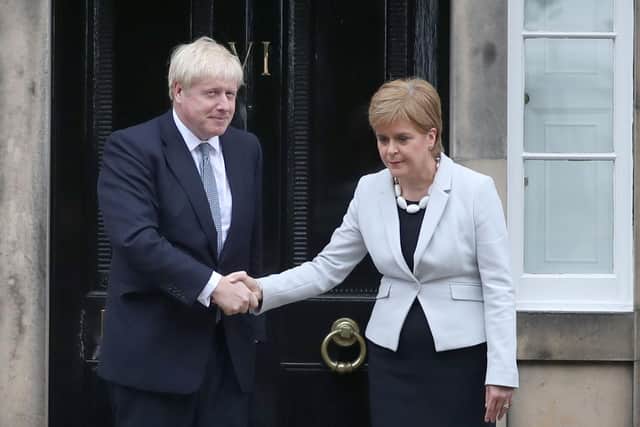 The First Minister Nicola Sturgeon welcomes Prime Minister Boris Johnson on his last visit (Picture: Jane Barlow/PA)