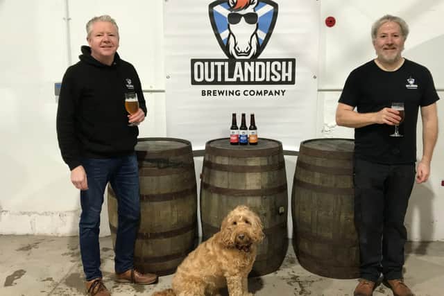 Ronnie Lees, Chester the dog and Kenny Lees of Outlandish Brewing Company.