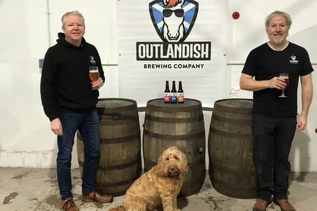 Ronnie Lees, Chester the dog and Kenny Lees of Outlandish Brewing Company.