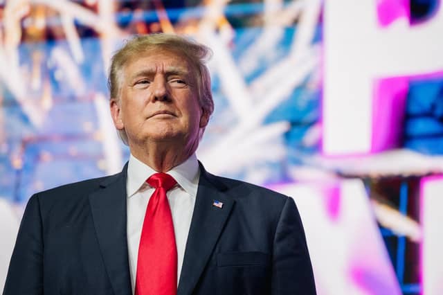 Former U.S. President Donald Trump makes an entrance at the Rally To Protect Our Elections conference on July 24, 2021 in Phoenix, Arizona. The Phoenix-based political organization Turning Point Action hosted former President Donald Trump alongside GOP Arizona candidates who have begun candidacy for government elected roles. (Photo by Brandon Bell/Getty Images)