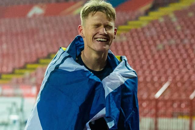 McTominay wraps himself in a saltire as he celebrates Scotland qualifying for the Euros in Serbia last November. Representing the nation of his father Frank at the tournament will be "a Privileg" he will be forever "thankful for". (Photo by Nikola Krstic / SNS Group)