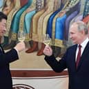 Chinese president Xi Jinping and Russia's Vladimir Putin toast each other during a reception in Moscow in March (Picture: Pavel Byrkin/Sputnik/AFP via Getty Images)