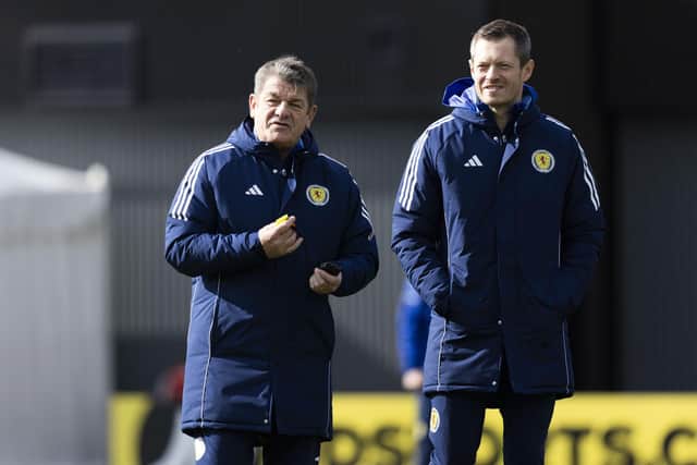 John Carver, left, casts his eye over Scotland training.