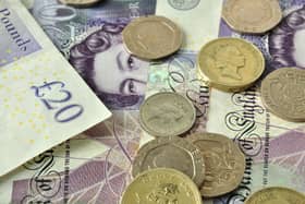 British currency, pound coins and banknotes. The UK's economic outlook is improving, but trade challenges remain.