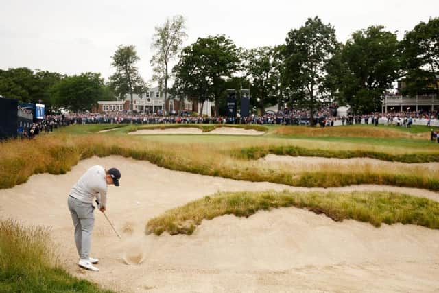 Matt Fitzpatrick plays his second shot from a fairway bunker at the 18th hole in the final round of the 122nd US Open. Picture: Jared C. Tilton/Getty Images.