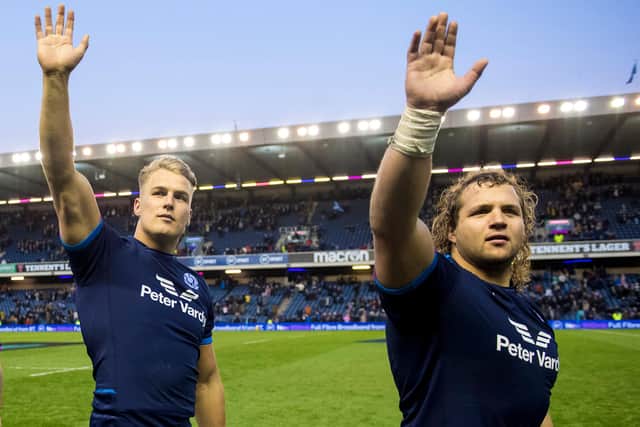 Scotland's Duhan van der Merwe (left) and Pierre Schoeman wave to the fans after the nailbiting 15-13 win over Australia at BT Murrayfield. (Photo by Ross Parker / SNS Group)
